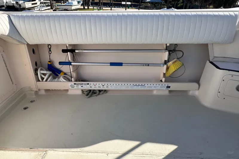  Yacht Photos Pics 2007 Grady-White Marlin 300 boat deck with cleaning tools and storage area.