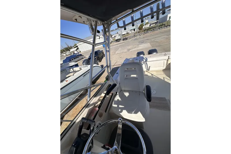  Yacht Photos Pics 2007 Grady-White Marlin 300 boat interior with steering wheel and seating area.