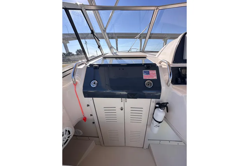  Yacht Photos Pics 2007 Grady-White Marlin 300 helm with American flag sticker and fire extinguisher.