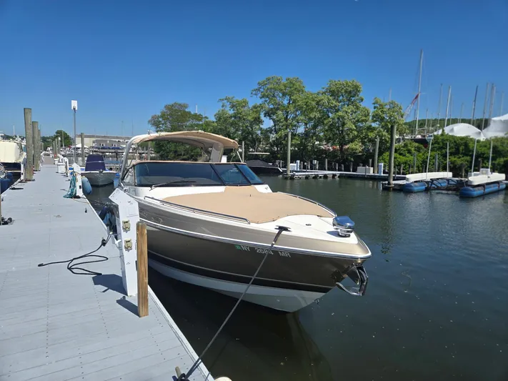  Yacht Photos Pics 2015 Formula 330 Crossover Bowrider docked at marina under clear blue sky.