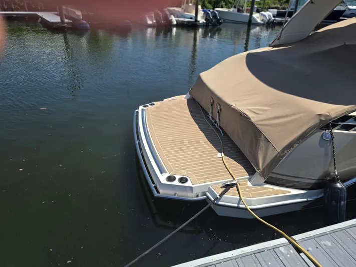  Yacht Photos Pics 2015 Formula 330 Crossover Bowrider docked with cover, rear view.