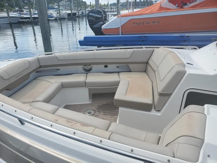  Yacht Photos Pics 2015 Formula 330 Crossover Bowrider with spacious seating at a marina.