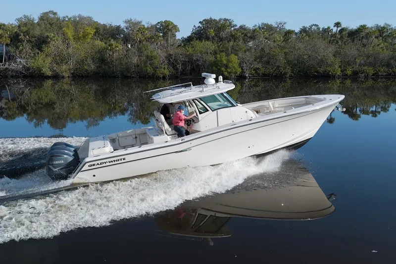 Lucky Penny II Yacht Photos Pics 2018 Grady-White Canyon 376 boat cruising on a calm river.
