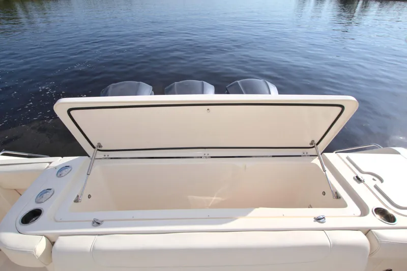 Lucky Penny II Yacht Photos Pics Open storage compartment on 2018 Grady-White Canyon 376 boat by the water.
