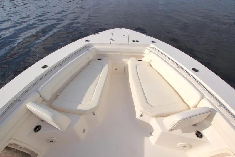 Lucky Penny II Yacht Photos Pics 2018 Grady-White Canyon 376 boat interior with cushioned seating, on calm water.