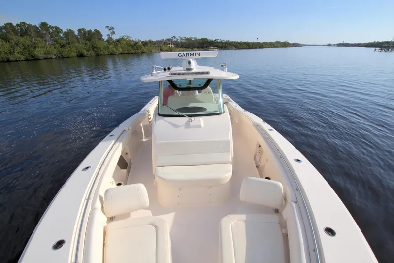 Lucky Penny II Yacht Photos Pics 2018 Grady-White Canyon 376 boat on calm water, featuring spacious seating and Garmin equipment.