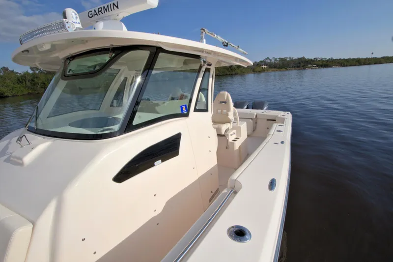 Lucky Penny II Yacht Photos Pics 2018 Grady-White Canyon 376 boat on calm water, featuring Garmin equipment.