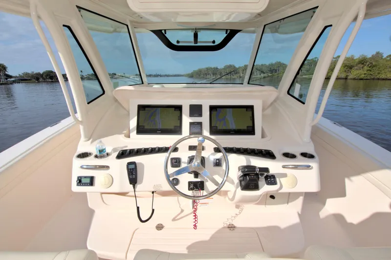 Lucky Penny II Yacht Photos Pics 2018 Grady-White Canyon 376 helm with dual navigation screens and steering wheel.