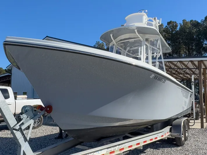 Parker 2801 With Tower And Trailer! Yacht Photos Pics Parker 2801 boat from 2022 on trailer, side view.