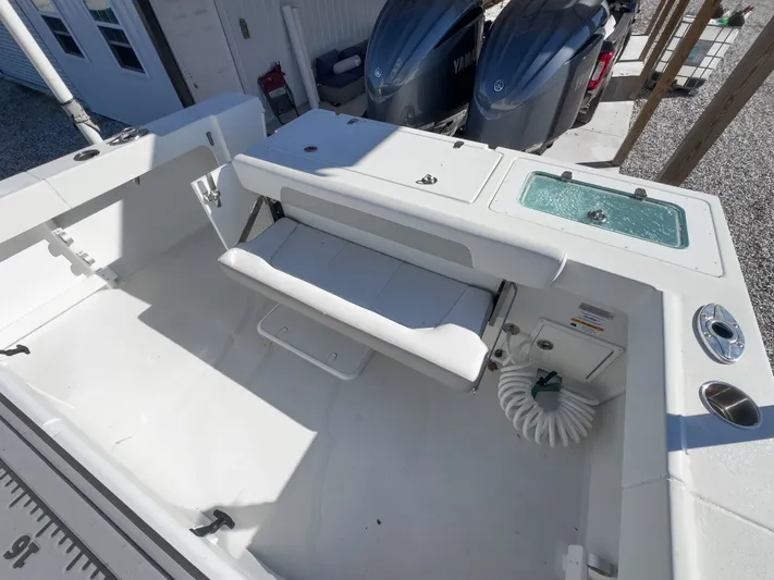 Parker 2801 With Tower And Trailer! Yacht Photos Pics Interior of a 2022 Parker 2801 boat with seating and engines.