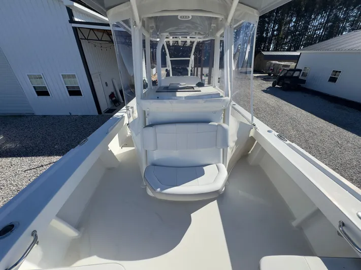 Parker 2801 With Tower And Trailer! Yacht Photos Pics Interior view of a 2022 Parker 2801 boat on a gravel lot.