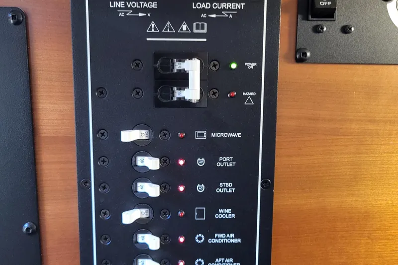 Tranquila Yacht Photos Pics Electrical panel of 2023 Cutwater C-288 Coupe boat, showing switches and indicators.