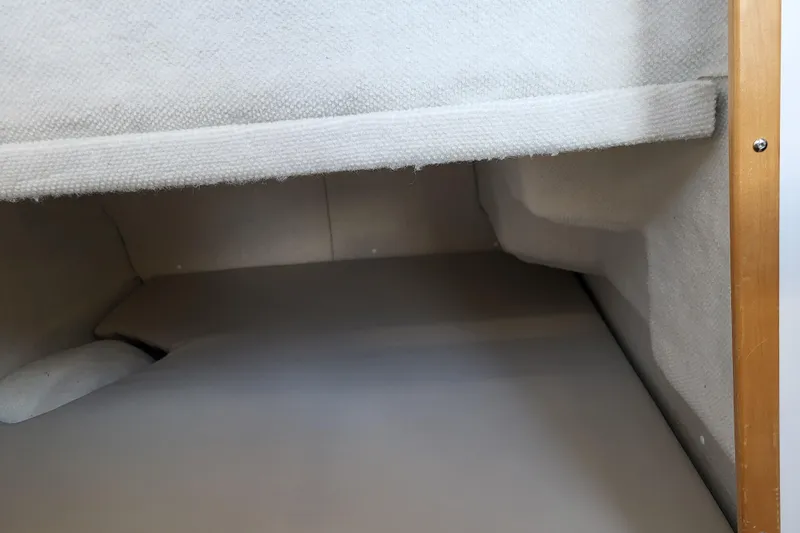 Tranquila Yacht Photos Pics Interior cabin space of 2023 Cutwater C-288 Coupe, featuring cozy, carpeted surfaces.