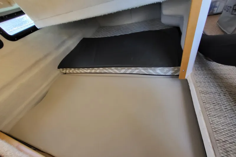 Tranquila Yacht Photos Pics 2023 Cutwater C-288 Coupe interior cabin with mattress and storage space.