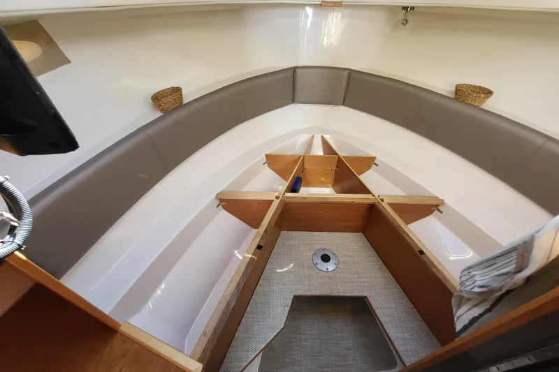 Tranquila Yacht Photos Pics 2023 Cutwater C-288 Coupe interior with seating and storage compartments.