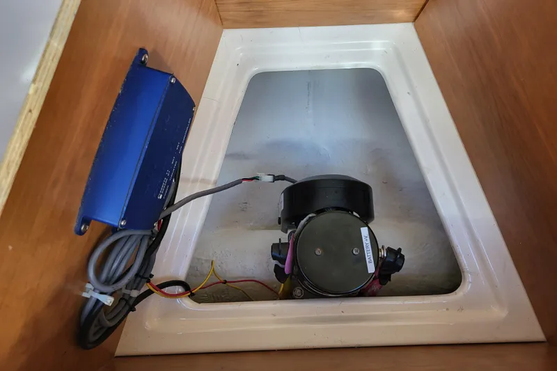 Tranquila Yacht Photos Pics 2023 Cutwater C-288 Coupe interior compartment with electrical components and wiring.