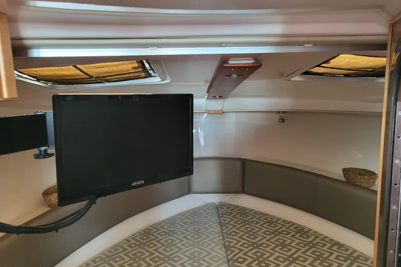 Tranquila Yacht Photos Pics Interior of 2023 Cutwater C-288 Coupe with TV and seating area.