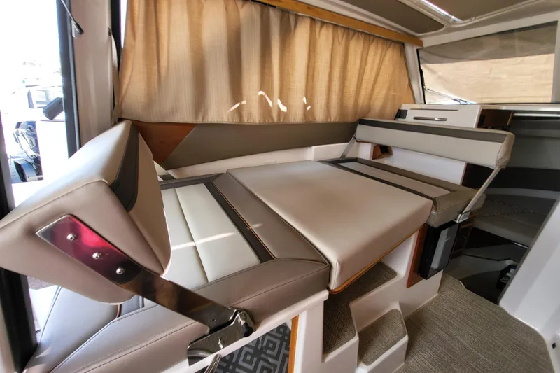 Tranquila Yacht Photos Pics 2023 Cutwater C-288 Coupe interior with convertible seating and modern design.