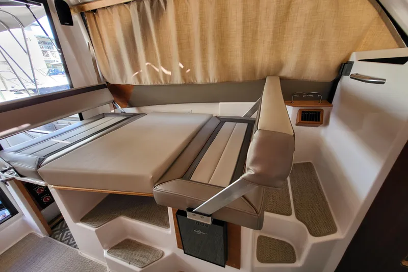Tranquila Yacht Photos Pics 2023 Cutwater C-288 Coupe interior with convertible seating and modern design.