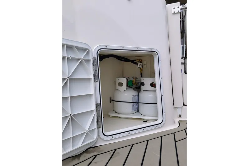 Tranquila Yacht Photos Pics 2023 Cutwater C-288 Coupe storage compartment with propane tanks.