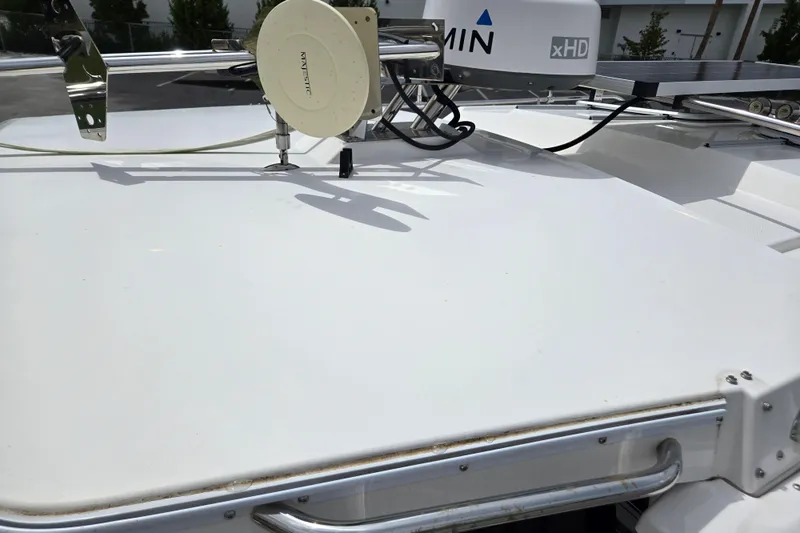 Tranquila Yacht Photos Pics 2023 Cutwater C-288 Coupe boat deck with radar and antenna equipment.