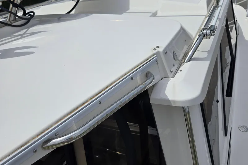 Tranquila Yacht Photos Pics 2023 Cutwater C-288 Coupe boat with sleek white exterior and stainless steel railing.