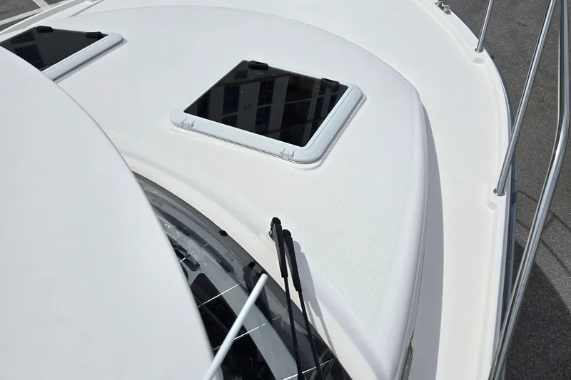 Tranquila Yacht Photos Pics 2023 Cutwater C-288 Coupe boat deck with hatches and railing.