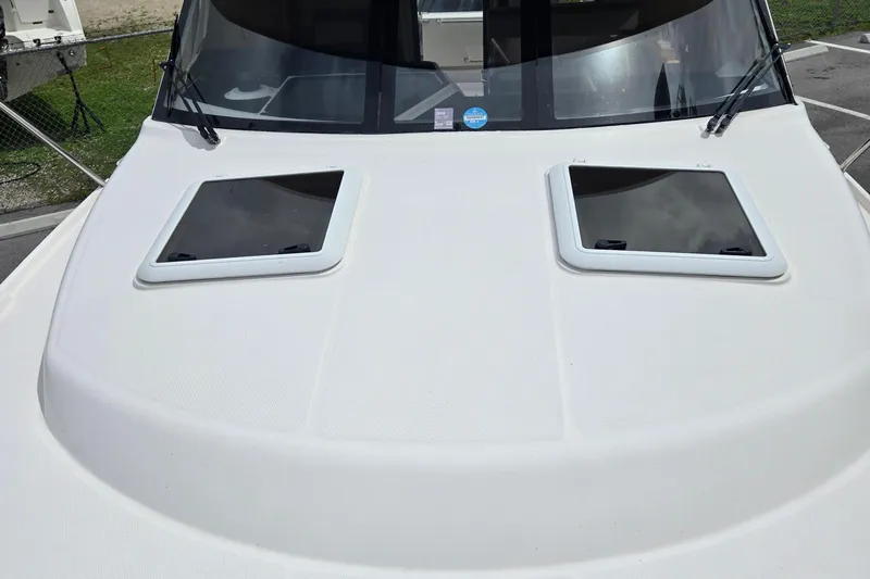 Tranquila Yacht Photos Pics 2023 Cutwater C-288 Coupe boat deck with dual hatches and windshield wipers.