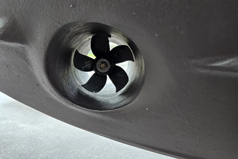 Tranquila Yacht Photos Pics Close-up of a 2023 Cutwater C-288 Coupe's propeller in a tunnel thruster.