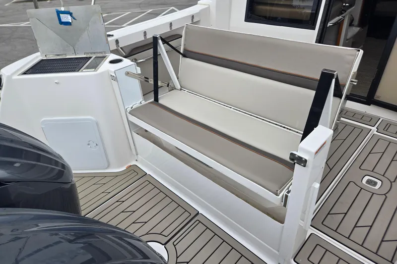 Tranquila Yacht Photos Pics 2023 Cutwater C-288 Coupe boat interior with foldable seating and deck details.