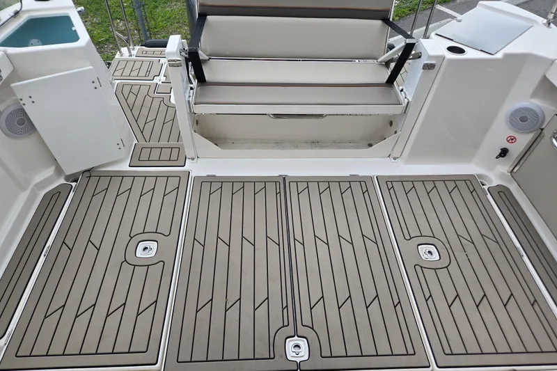 Tranquila Yacht Photos Pics 2023 Cutwater C-288 Coupe boat deck with seating and storage compartments.