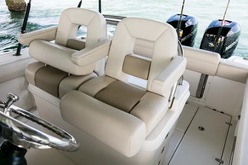  Yacht Photos Pics Manufacturer Provided Image: 2025 Boston Whaler 250 Outrage boat interior with dual seats and twin engines.