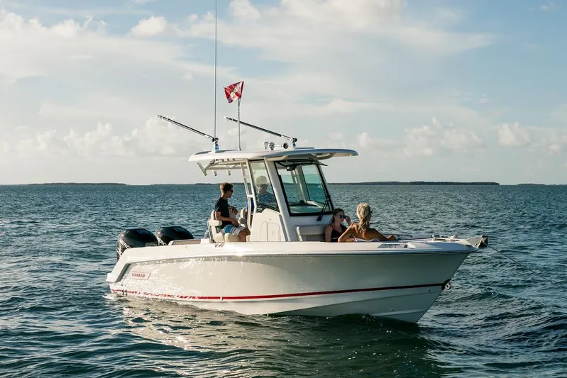  Yacht Photos Pics Manufacturer Provided Image: 2025 Boston Whaler 250 Outrage boat cruising on open water under a clear sky.