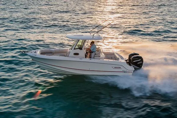  Yacht Photos Pics Manufacturer Provided Image: 2025 Boston Whaler 250 Outrage cruising on open water at sunset.
