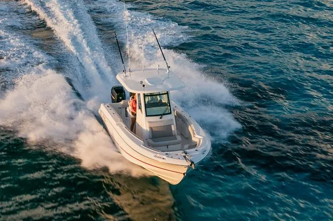  Yacht Photos Pics Manufacturer Provided Image: 2025 Boston Whaler 250 Outrage speeding on open water.