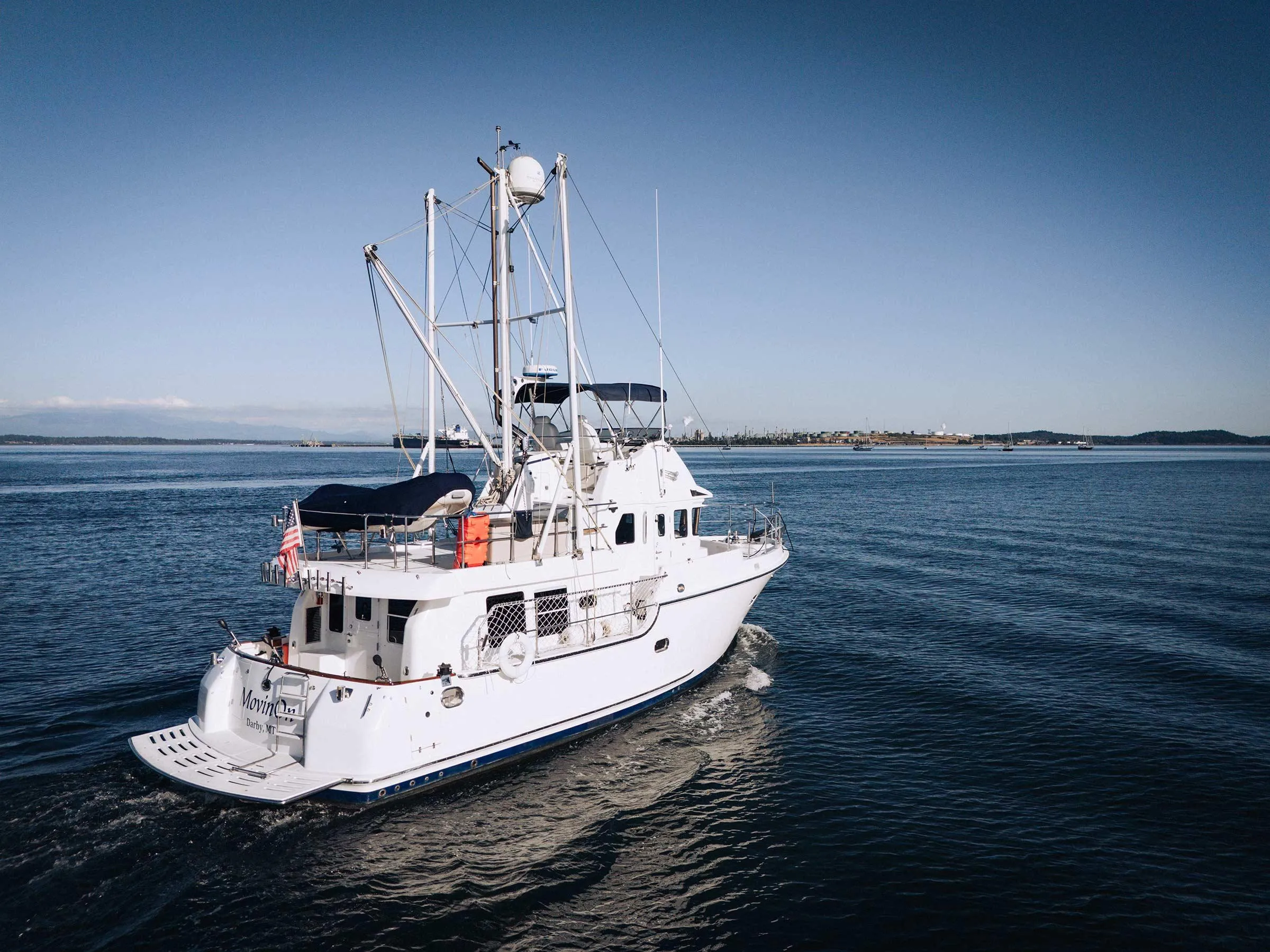 Nordhavn 43 yacht from 2004 cruising on calm blue waters.