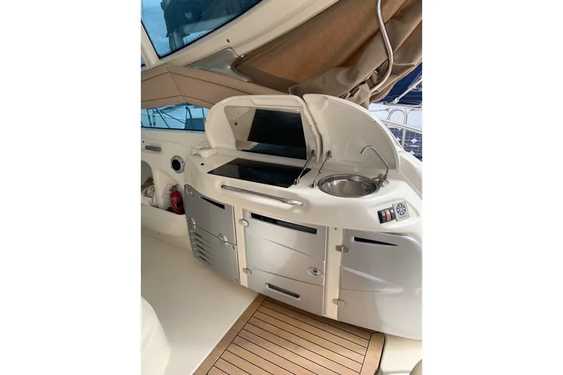  Yacht Photos Pics 2009 Cranchi Mediterranee 43 HT yacht interior with kitchenette and sink.