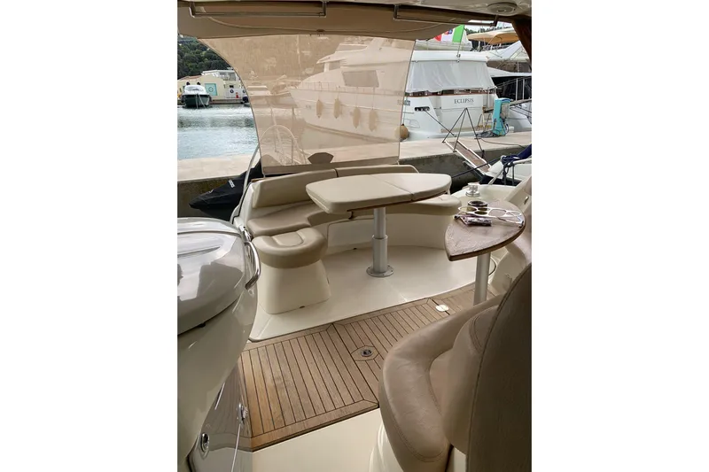  Yacht Photos Pics Luxurious 2009 Cranchi Mediterranee 43 HT yacht interior with elegant seating and table.