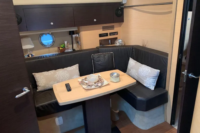  Yacht Photos Pics Interior of 2009 Cranchi Mediterranee 43 HT yacht with cozy seating and decorative pillows.