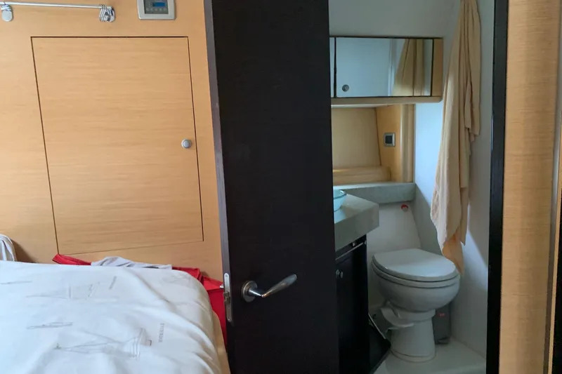  Yacht Photos Pics 2009 Cranchi Mediterranee 43 HT yacht interior with bathroom and bedroom view.