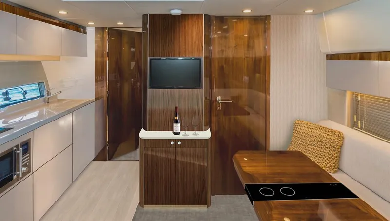 New For 2026 Yacht Photos Pics Luxurious interior of 2025 Fairline Targa 50 Open yacht with modern kitchen and dining area.