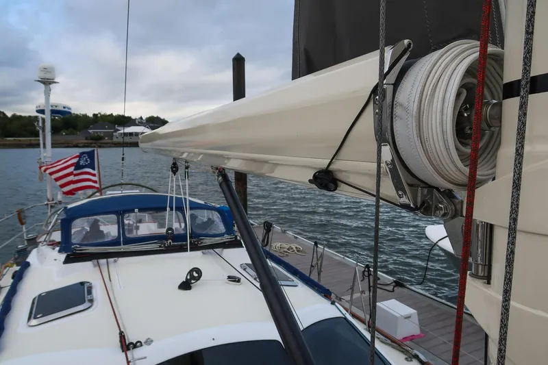 Next Boat Yacht Photos Pics Sailboat docked, Morris Ocean Series 45, 2007, with American flag and overcast sky.
