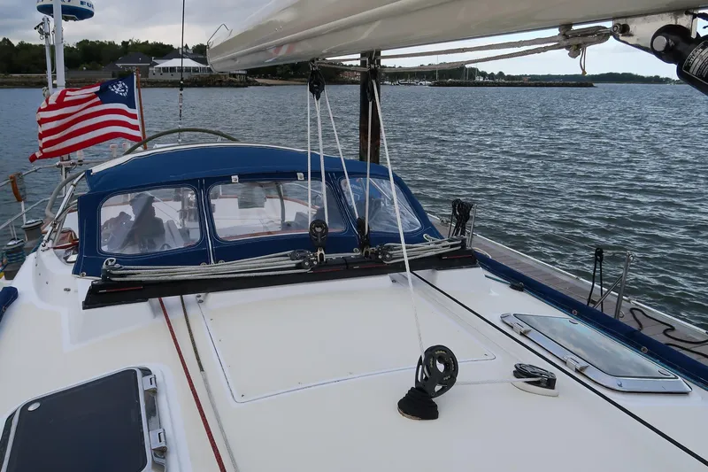 Next Boat Yacht Photos Pics Sailboat Morris Ocean Series 45, 2007 model, with American flag on calm waters.
