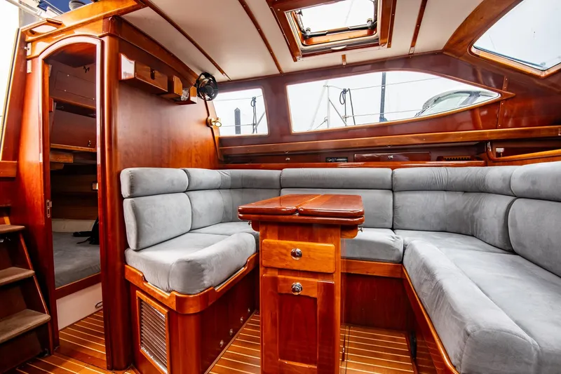 Next Boat Yacht Photos Pics Luxurious interior of 2007 Morris Ocean Series 45 yacht with plush seating and wooden finishes.