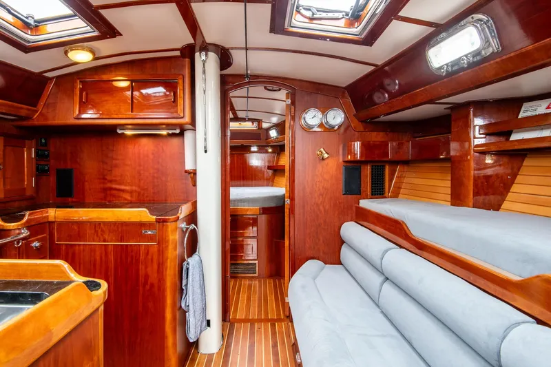 Next Boat Yacht Photos Pics Luxurious 2007 Morris Ocean Series 45 yacht interior with polished wood and cozy seating.
