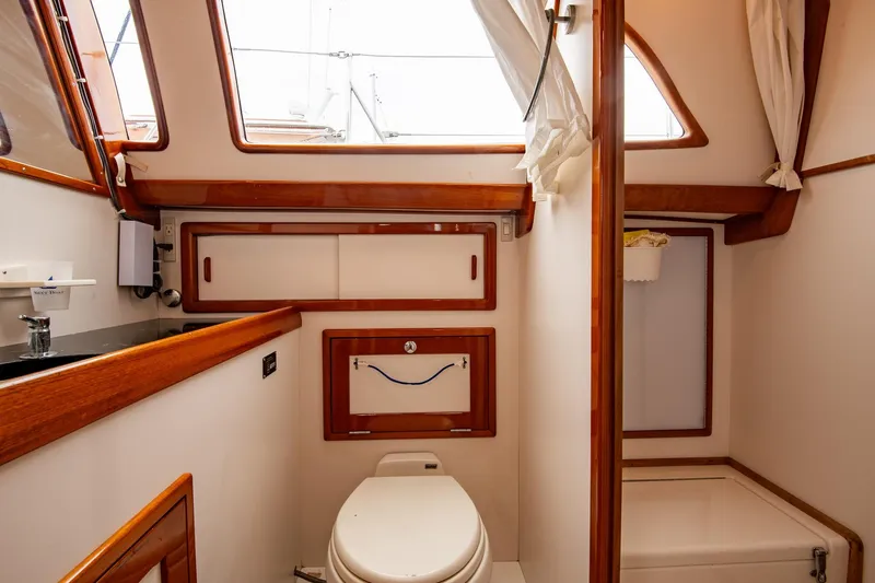 Next Boat Yacht Photos Pics Luxurious bathroom interior of 2007 Morris Ocean Series 45 yacht with wooden accents.