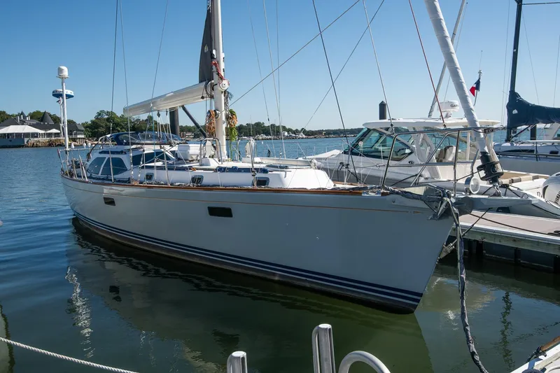 Next Boat Yacht Photos Pics Sailboat Morris Ocean Series 45, 2007 model, docked in a marina on a sunny day.