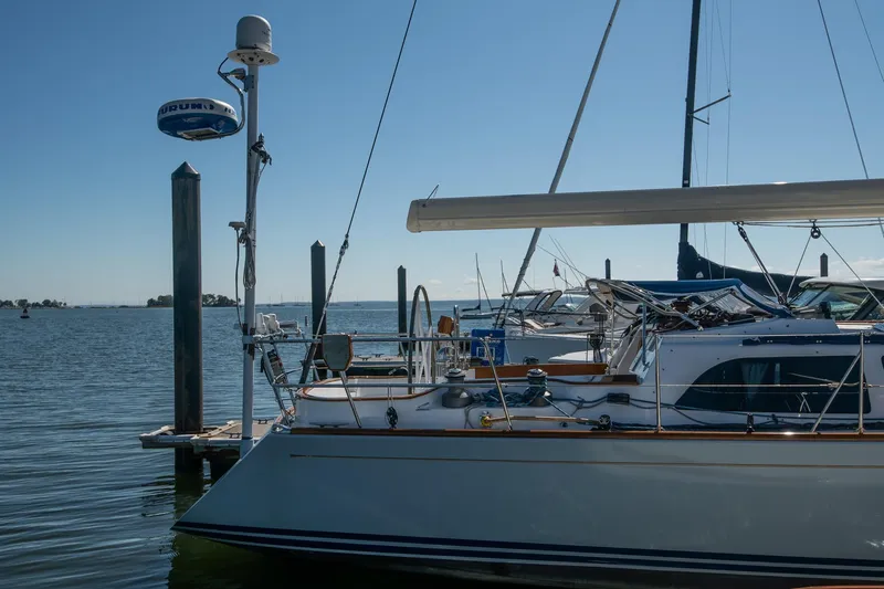 Next Boat Yacht Photos Pics 2007 Morris Ocean Series 45 yacht docked at a marina on a sunny day.