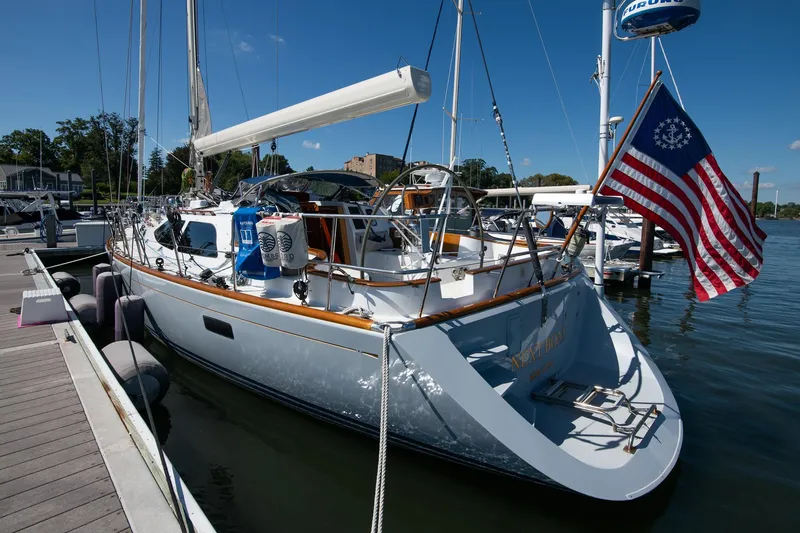 Next Boat Yacht Photos Pics Sailboat docked at marina, Morris Ocean Series 45, 2007, with American flag.