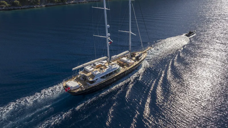 Atlantika Yacht Photos Pics Aerial view of a 2013 custom sailing yacht cruising on the ocean.